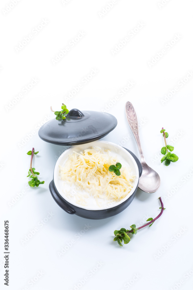 sweet boiled vermicelli with milk in a ceramic bowl