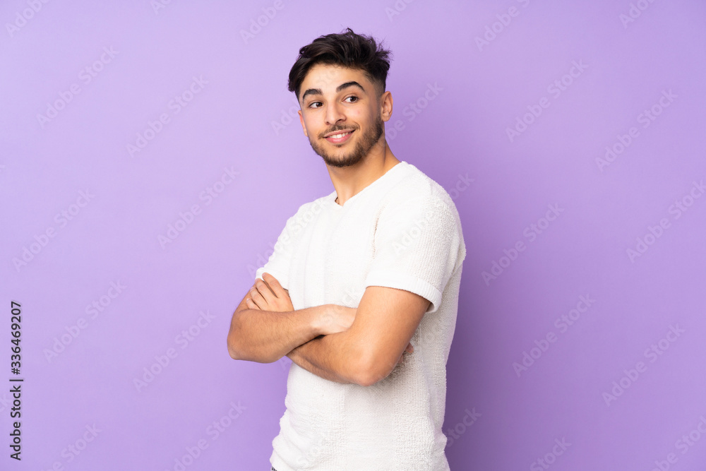 Arabian handsome man over isolated background looking to the side and smiling Arabian handsome man over isolated background looking to the side and smiling