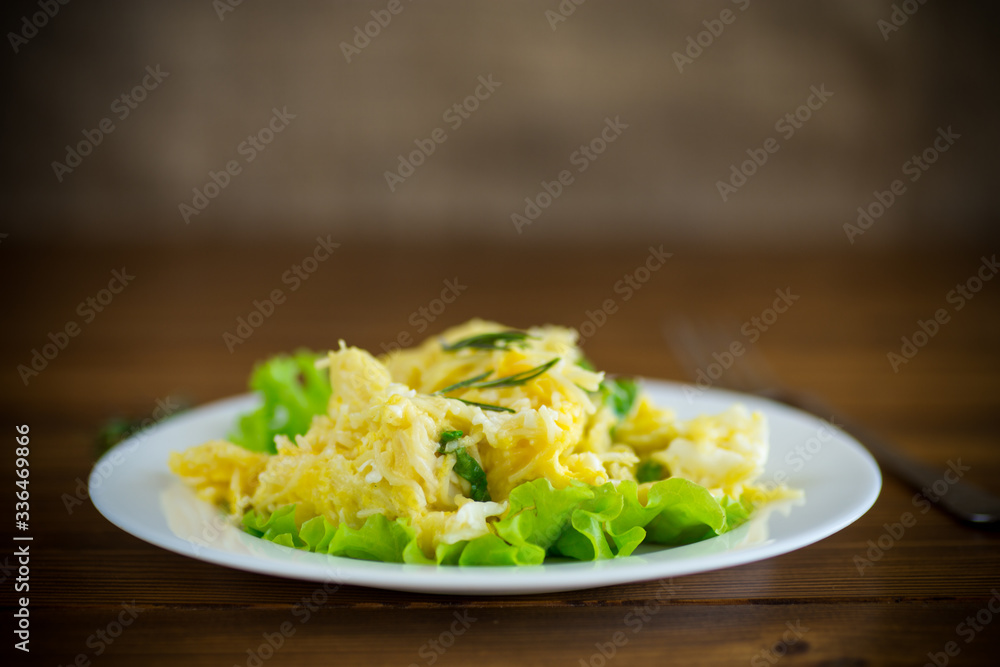 fried omelet with thin vermicelli with salad leaves in a plate fried omelet with thin vermicelli with salad leaves in a plate