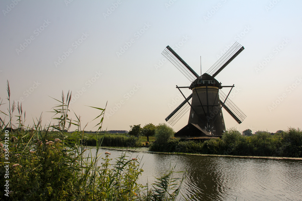 Kinderdijk Mill by the river and with its reflection