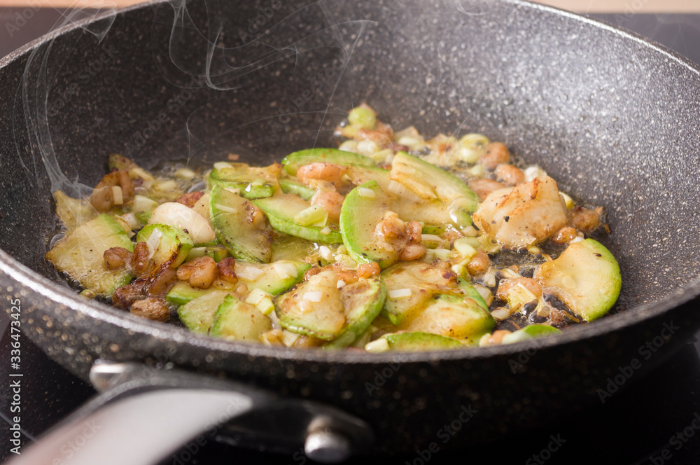 Scrambled eggs with garlic, zucchini, and shrimp. Cooking steps