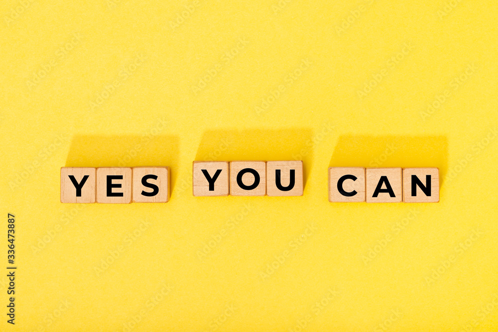 Yes you can message on wooden blocks. Motivational Words Quotes Concept Yes you can message on wooden blocks. Motivational Words Quotes Concept