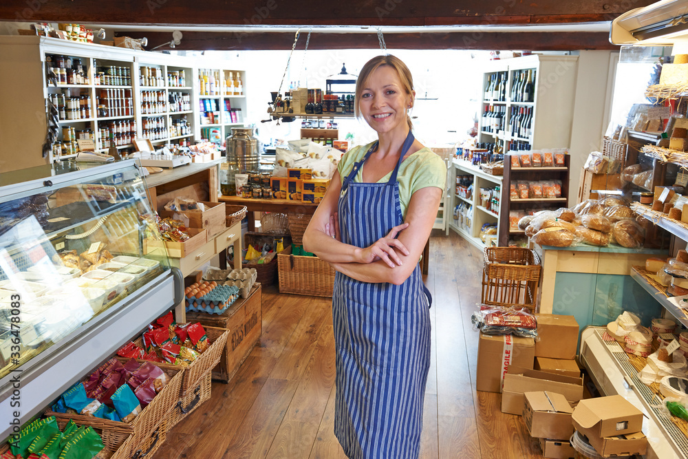 Portrait Of Female Owner Of Delicatessen Standing In Shop