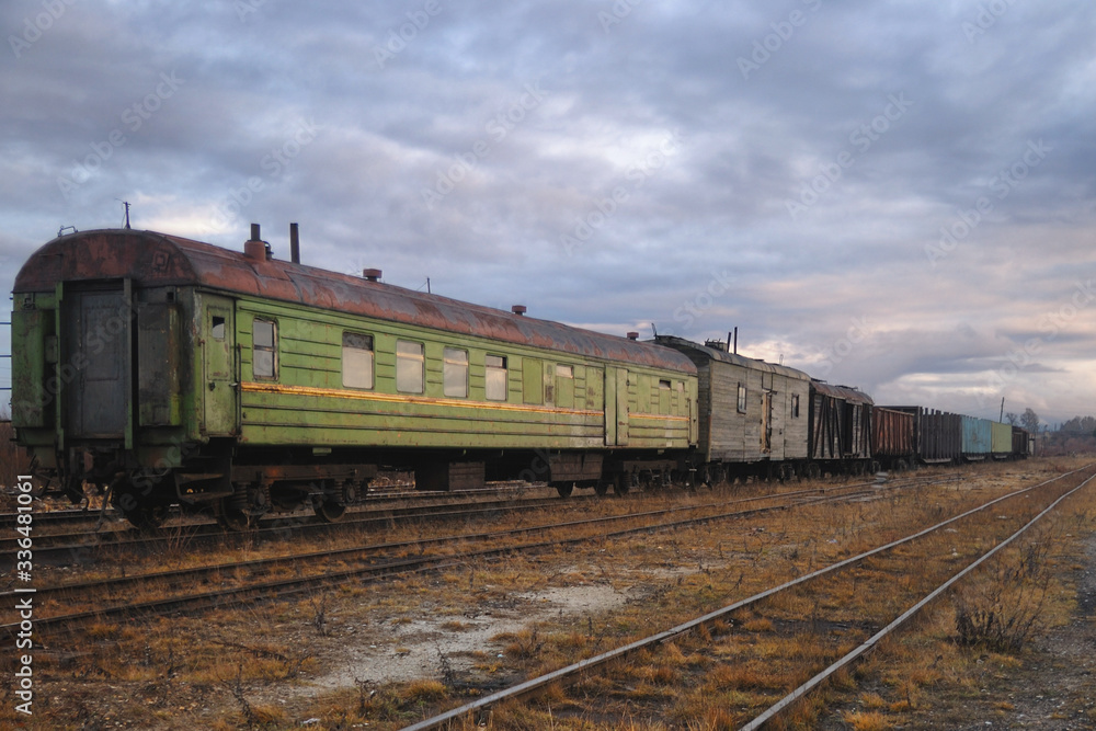 Old cars on the abandoned station tracks in Russia Old cars on the abandoned station tracks in Russia