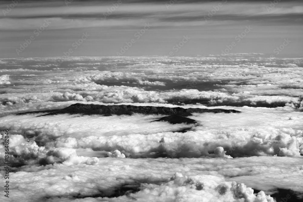 Top view on clouds and mountains
