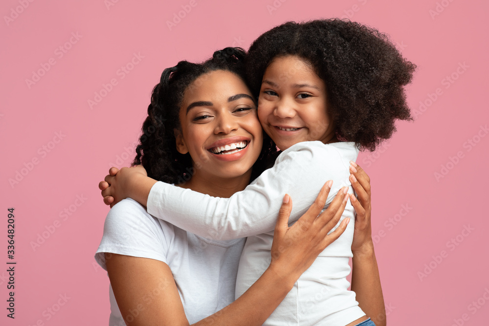 Mommy's Girl. Smiling Black Woman Embracing Her Cute Little Daughter Mommy's Girl. Smiling Black Woman Embracing Her Cute Little Daughter