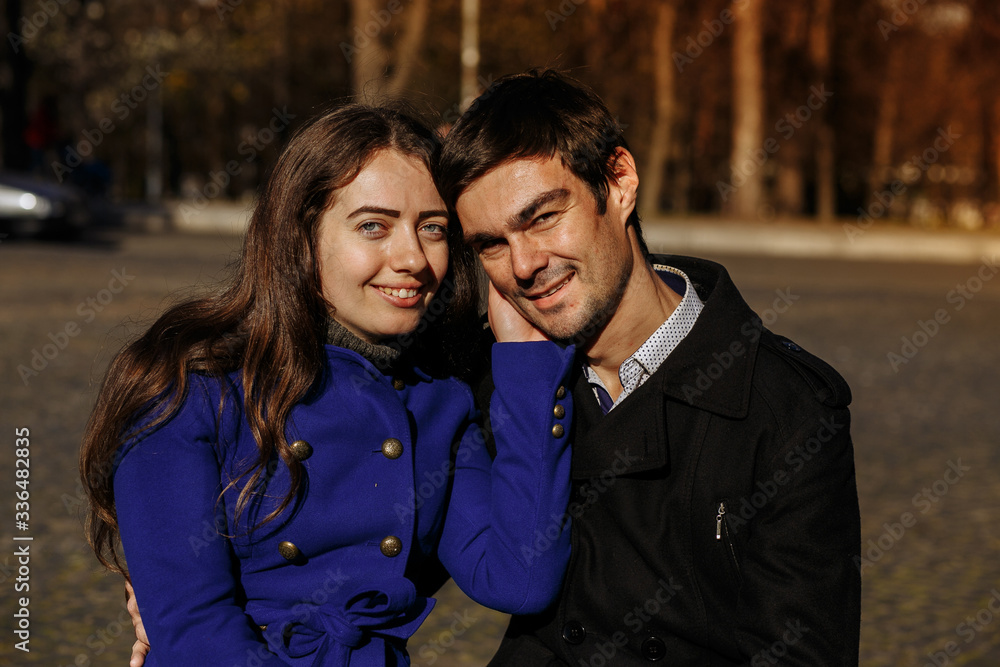 guy with a girl in the park on a sunny day. Autumn in the park. happy day guy with a girl in the park on a sunny day. Autumn in the park. happy day