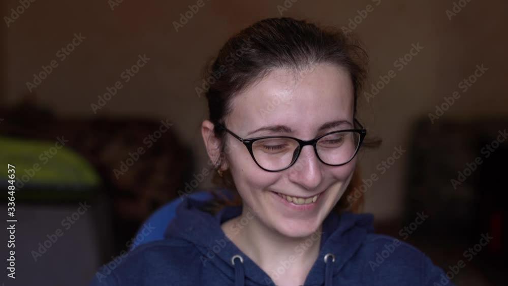 Portrait of the girl with the glasses sitting at home in quarantine. Depressed Portrait of the girl with the glasses sitting at home in quarantine. Depressed