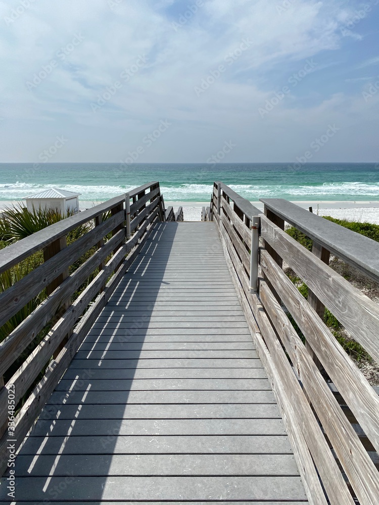 wooden bridge over the Gulf of Mexico water Florida beach