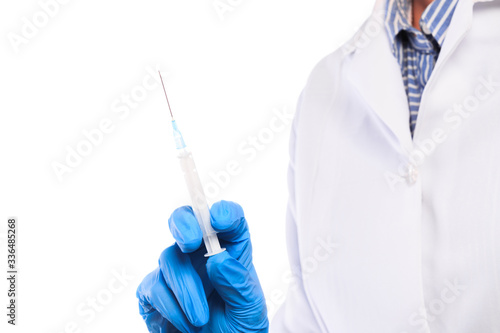 Doctor hand in sterile gloves holding syringe isolated on white background - Image