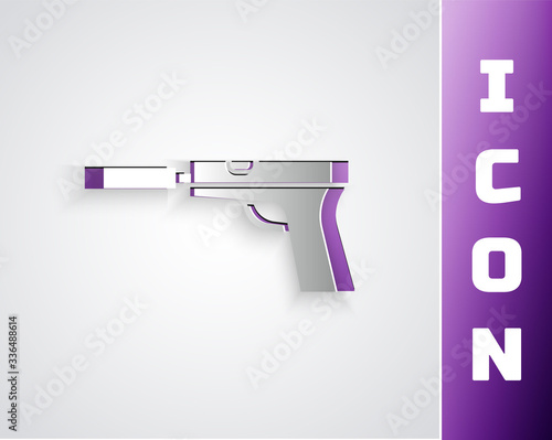 Paper cut Pistol or gun with silencer icon isolated on grey background. Paper art style. Vector Illustration