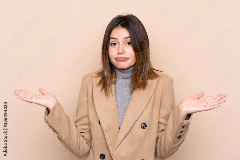 Young woman over isolated background having doubts with confuse face expression Young woman over isolated background having doubts with confuse face expression