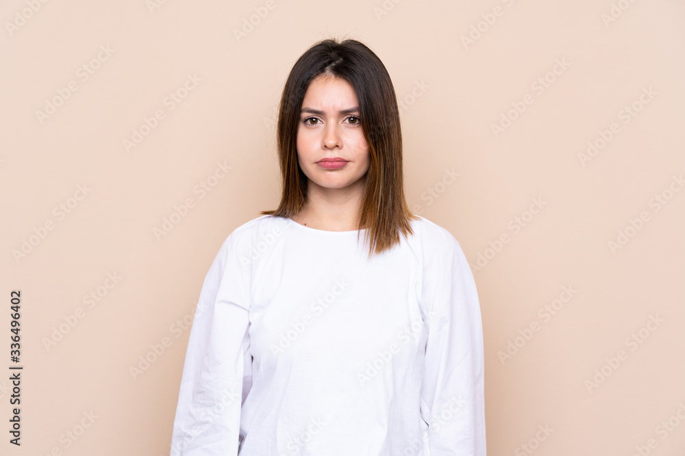 Young woman over isolated background sad Young woman over isolated background sad