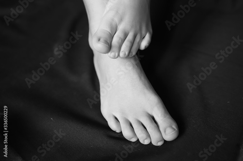 black and white photo of female feet, beautiful female legs