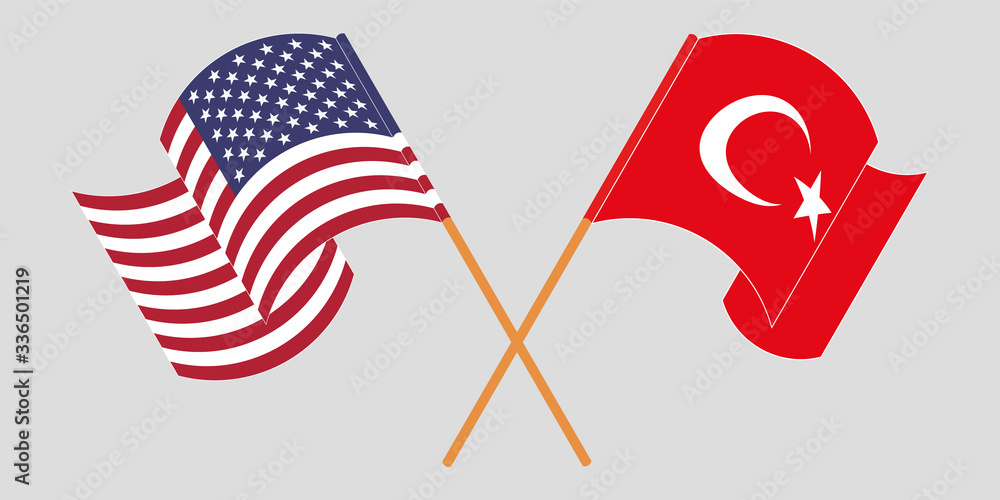 Crossed and waving flags of Turkey and the USA
