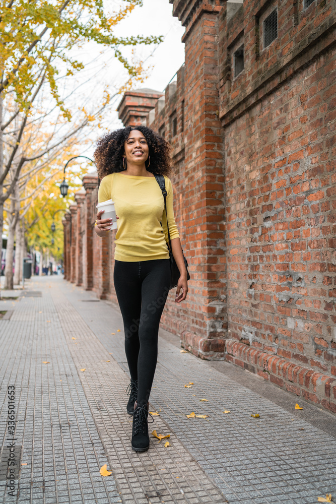 Afro-american woman walking on the street. Afro-american woman walking on the street.