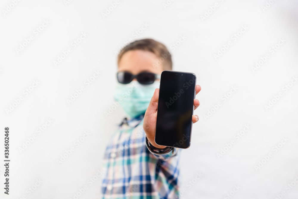 Health protection. Kids in quarantine using mobile phone Health protection. Kids in quarantine using mobile phone
