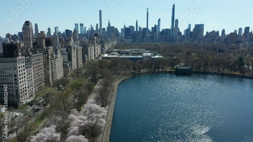 view of Central Park in NYC facing south flying east across 5th Ave.