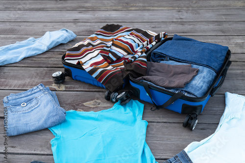 The wardrobe order. Cleaning things. Putting things in a suitcase. Preparing for the trip. Stop traveling. Stay at home. Concept.