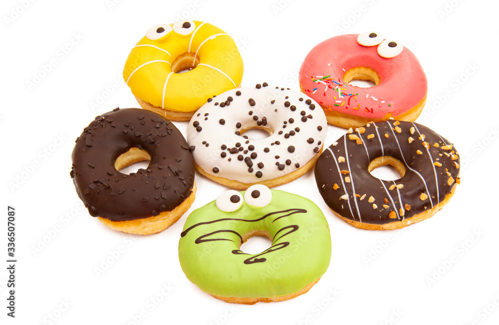 homemade donuts in colored glaze isolated o\ homemade donuts in colored glaze isolated o\