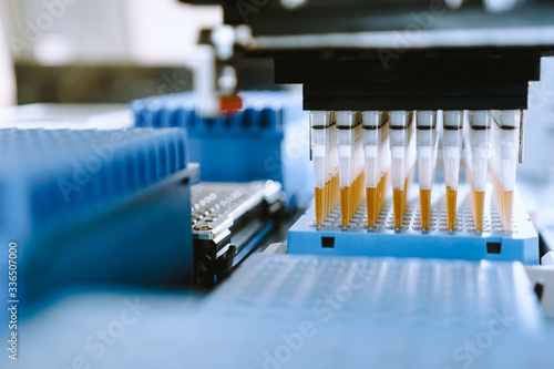 Automation in the clinical laboratory. Pipetting robot laboratory. Medicine robotics. Research and science background