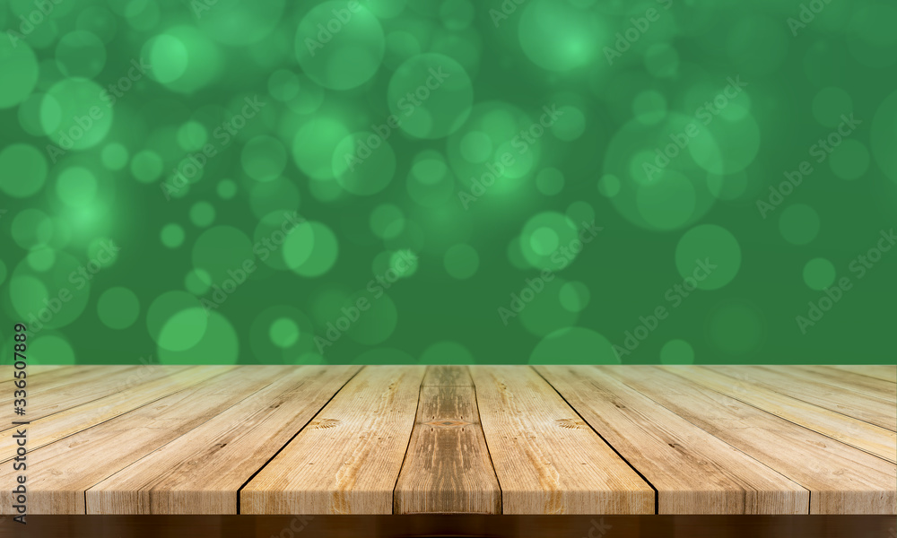 Empty wooden table with a beautiful colour bokeh background