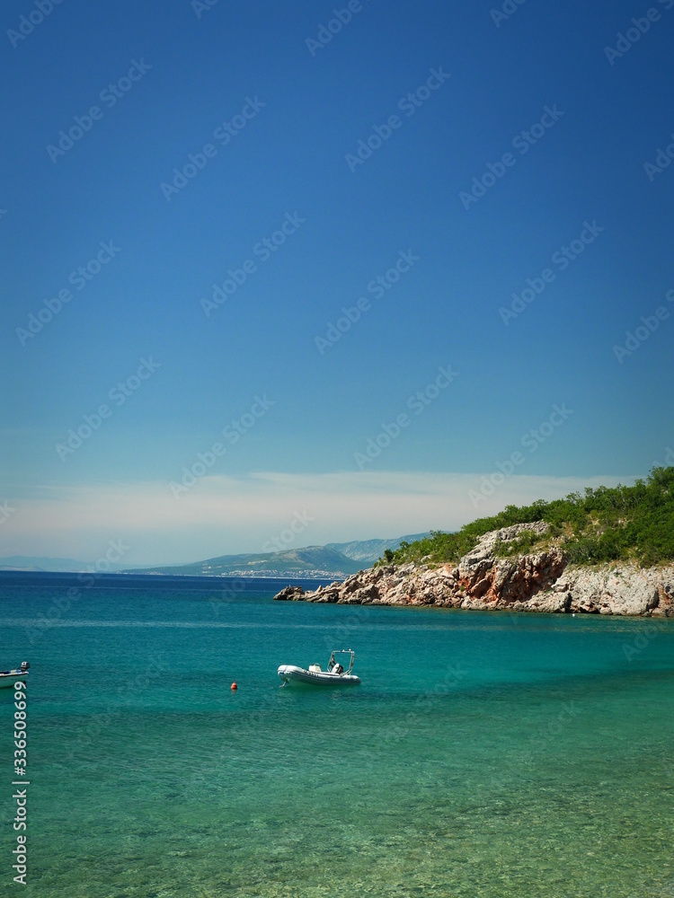 stone coast azure water