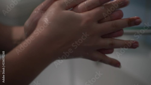 Wallpaper Mural The girl washes her hands with soap and water. Hygiene Torontodigital.ca