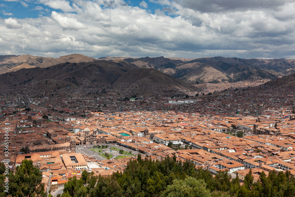 Red brick roofs. Colonial town. Panorama view historical center Cusco Peru 