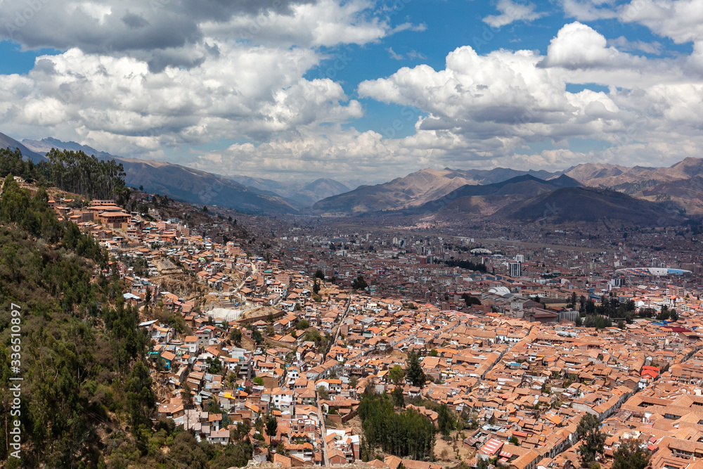 Red brick roofs. Colonial town. Panorama view historical center Cusco Peru 