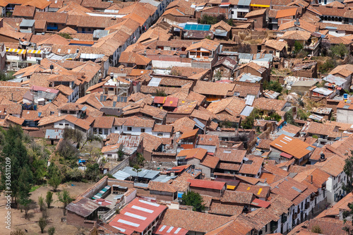 Red brick roofs. Colonial town. Panorama view historical center Cusco Peru 