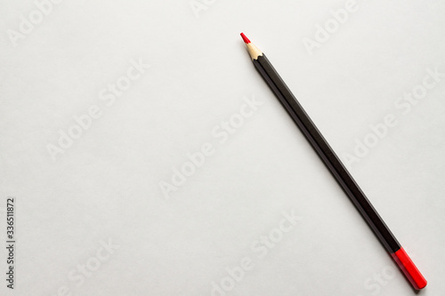 red pencil on blank white album paper. Top view. school and office supplies. Copy space.