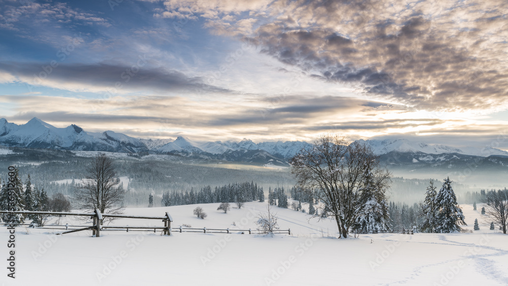 Beautiful sky over the snowy mountains  peaks