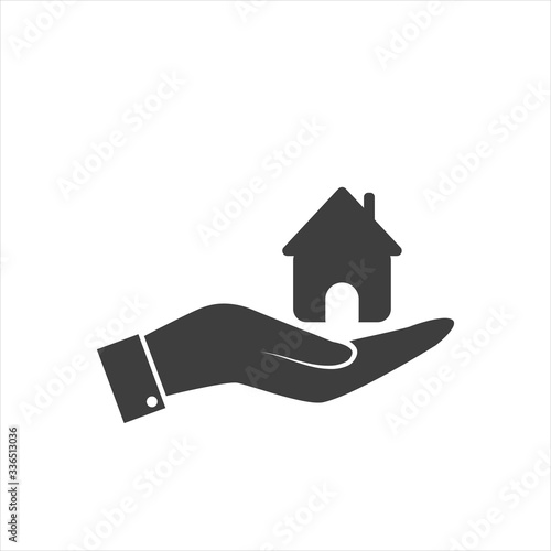 Human hand with a house icon on a white background.