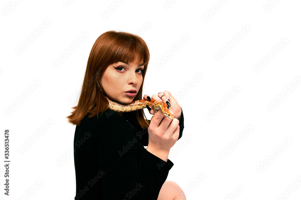 Beautiful woman in black bodywear and snake. Ginger model girl with fashion perfect make up. Beautiful woman in black bodywear and snake. Ginger model girl with fashion perfect make up.