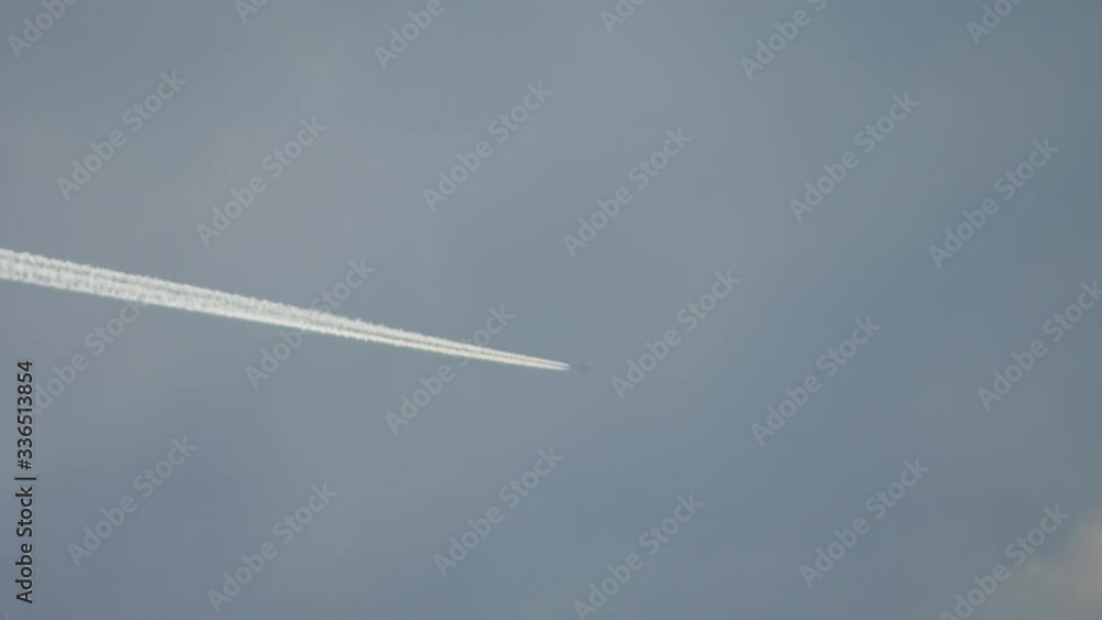 Airplane leaves chemical traces in the blue sky. Chemical traces in atmosphere. Airplane leaves chemical traces in the blue sky. Chemical traces in atmosphere.