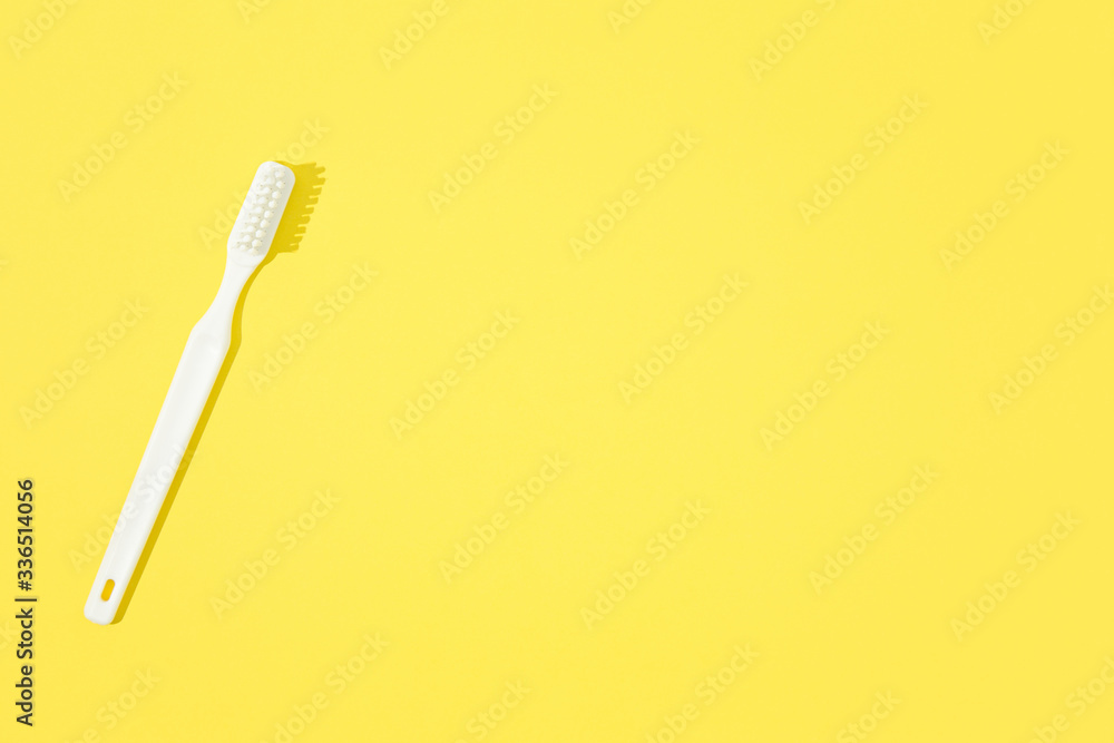 Toothbrush on yellow pastel background. Toothbrush on yellow pastel background.