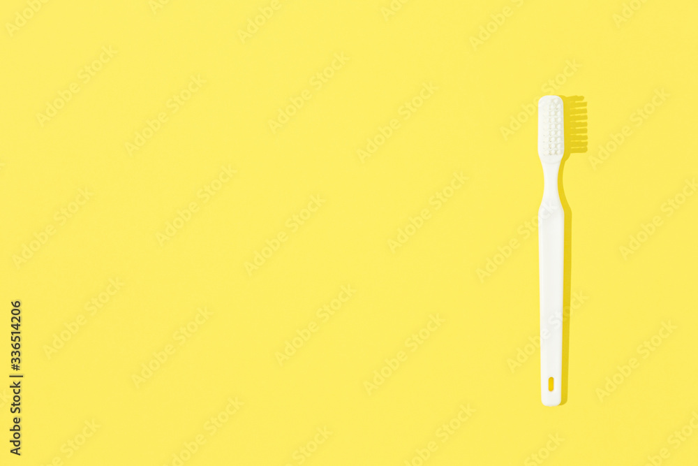Toothbrush on yellow pastel background. Toothbrush on yellow pastel background.