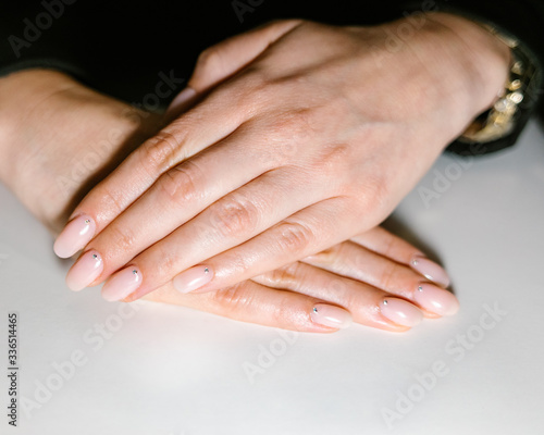 Woman's hand with pink nails