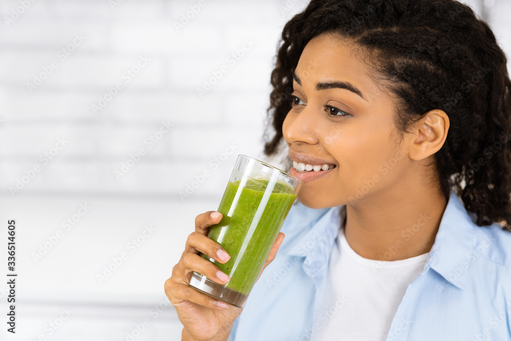 Afro Girl Drinking Smoothie And Looking Away Afro Girl Drinking Smoothie And Looking Away
