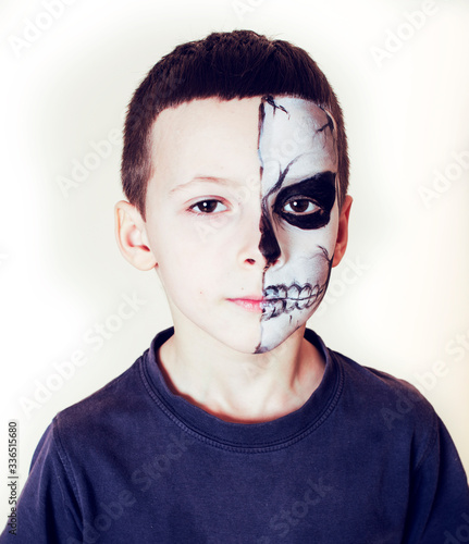 little cute boy with facepaint like skeleton to celebrate halloween, lifestyle people concept, children on holiday