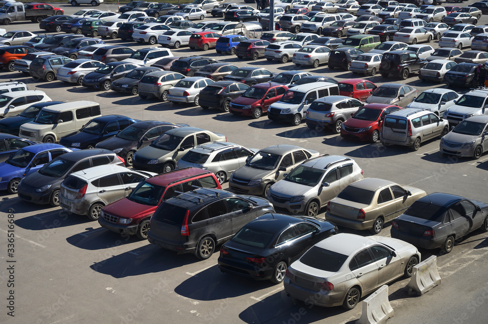 View of a crowded car park in the city center. selling used cars. lack of parking spaces during the holidays