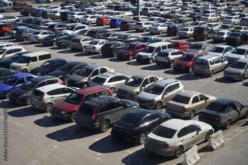 View of a crowded car park in the city center. selling used cars. lack of parking spaces during the holidays