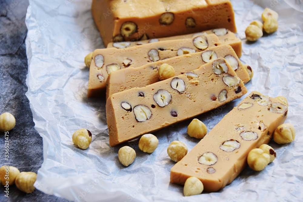 Homemade hazelnut fudge on the light background Homemade hazelnut fudge on the light background