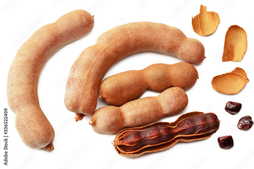 fresh tamarind fruits isolated on white background. top view fresh tamarind fruits isolated on white background. top view