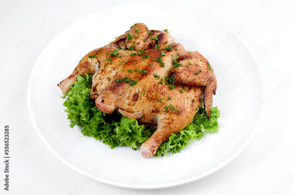 fried chicken whole carcass with vegetables on a white background