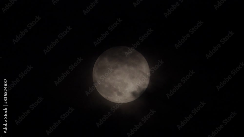 Dark clouds pass by tonight's full moon, a supermoon known as the Pink Moon, as seen from Wakefield, Yorkshire. Dark clouds pass by tonight's full moon, a supermoon known as the Pink Moon, as seen from Wakefield, Yorkshire.