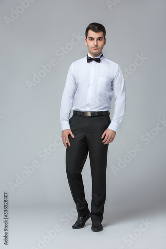 2020 Clothes, Waiter for concept design. White background isolated. Customer service. Handsome young man isolated. Service concept.