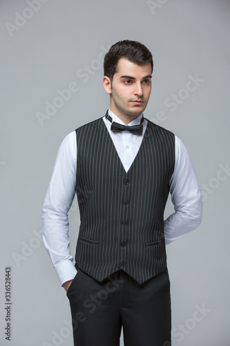 2020 Clothes, Waiter for concept design. White background isolated. Customer service. Handsome young man isolated. Service concept.