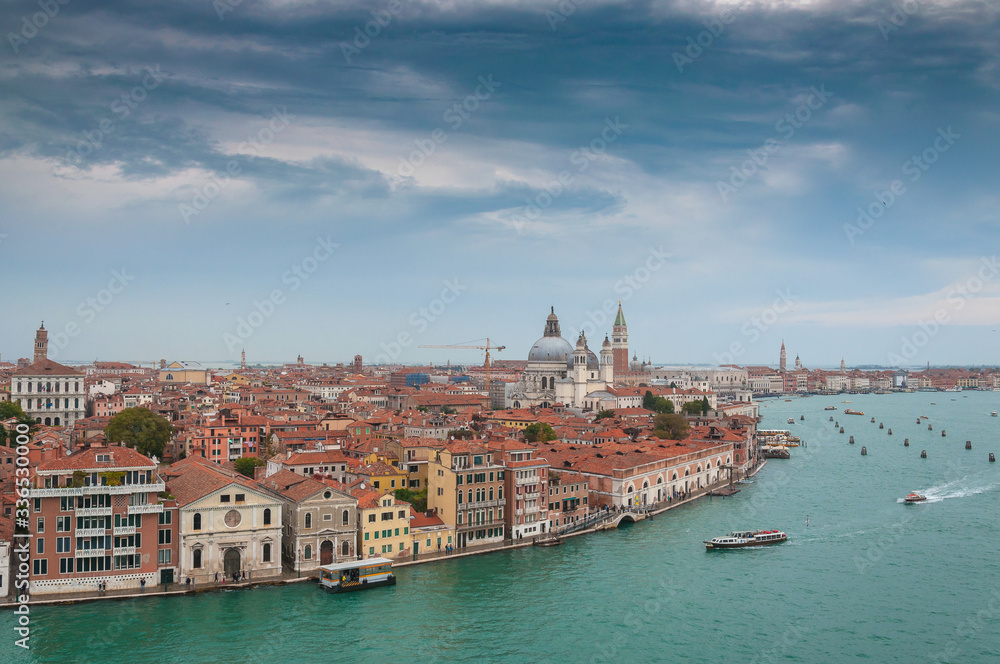 Venice aerial view from Giudecca channel in a cloudy day, Venice, Italy. Concept: historic Italian places, evocative and little-known views of Venice